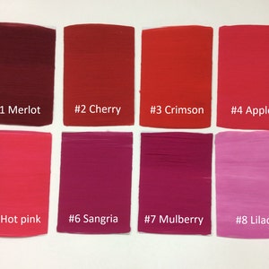 Puede incluir: Ocho muestras de pintura en varios tonos de rojo y rosa, etiquetadas con números y nombres: #1 Merlot, #2 Cereza, #3 Carmesí, #4 Manzana, #5 Rosa intenso, #6 Sangría, #7 Morera, #8 Lila.