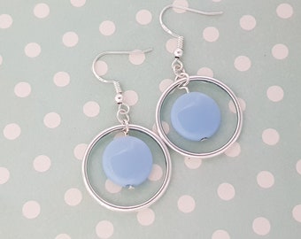 Pastel blue earrings with a large silver hoop