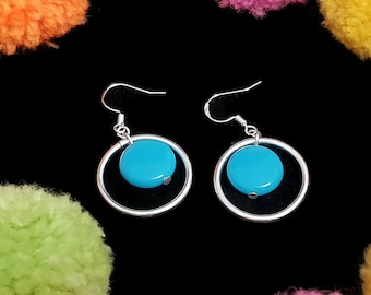 Mid century modern circle earrings with a silver medium hoop and turquoise bead