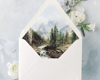 May include: A white envelope with a landscape painting of mountains and trees. The envelope is surrounded by white and purple flowers on a light blue background. The painting inside the envelope depicts a river flowing through a forest.