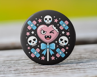 Subtle Transgender Pride Button - “Chompy”, The Vampiric Lollipop - Available as a Pin, Keychain, Magnet, Zipper Pull