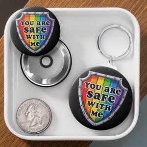 You Are Safe With Me Rainbow Shield Button in Black - Available as Pin, Keychain, Magnet, or Zipper Pull
