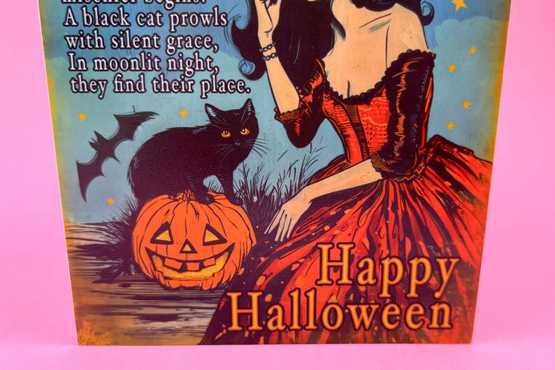 May include: A vintage-style Halloween illustration featuring a black cat perched on a carved pumpkin. A woman in a red dress is depicted, with the words "Happy Halloween" prominently displayed. The background has a blue sky with stars.