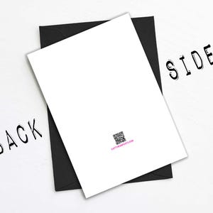 May include: A white card with a black envelope, labeled "BACK" and "SIDE" in a handwritten font. A QR code and website address are printed on the card. The card is angled on a white surface.