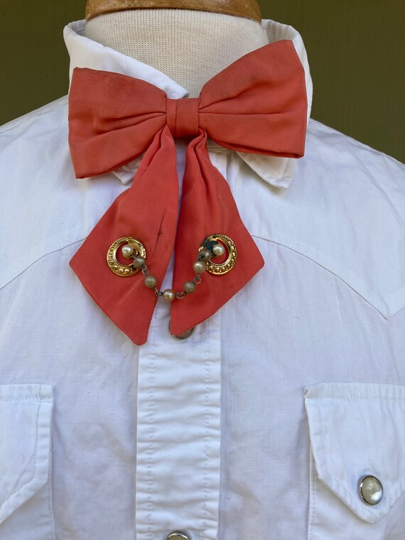 Vintage 1950’s Coral Ladies long fancy bow neck ti