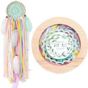 May include: A DIY dreamcatcher kit with a wooden hoop, green and pink crochet lace, colorful ribbons, feathers, and beads. The kit includes instructions for creating a dreamcatcher.
