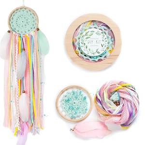 May include: DIY dreamcatcher kit with a wooden hoop, turquoise crochet lace, pink and yellow ribbons, feathers, and beads. The kit includes instructions for creating a dreamcatcher.