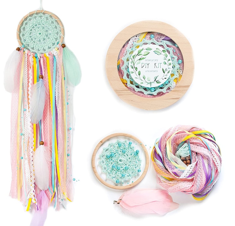 May include: DIY dreamcatcher kit with a wooden hoop, turquoise crochet lace, pink and yellow ribbons, feathers, and beads. The kit includes instructions for creating a dreamcatcher.