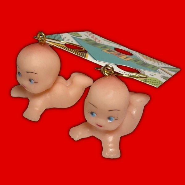 kewpie doll, baby doll, weird hoop earrings