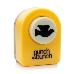 May include: Yellow punch tool with a white circle in the center. The circle has a black silhouette of a bird inside. The tool says "punch bunch" in black letters.