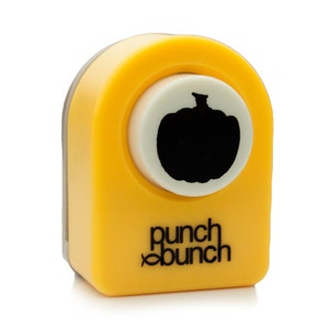 Può includere: Utensile da punzonatura giallo con una silhouette di zucca nera su un cerchio bianco. Lo strumento è etichettato "punch bunch".