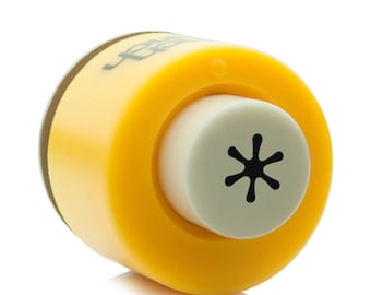 May include: Yellow and white plastic craft punch with a star-shaped design. The punch is used to create decorative holes in paper.