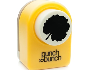 May include: Yellow punch bunch paper punch with a black leaf design.