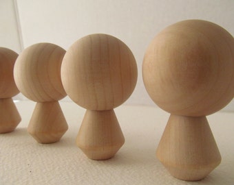 unfinished kokeshi dolls