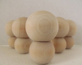 unfinished kokeshi dolls