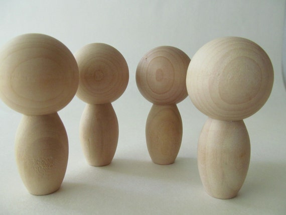 unfinished kokeshi dolls
