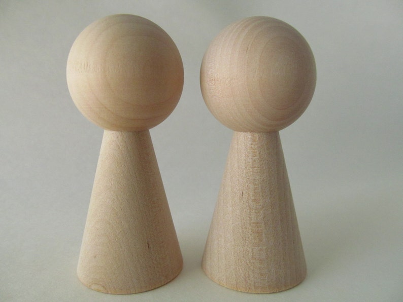 unfinished kokeshi dolls