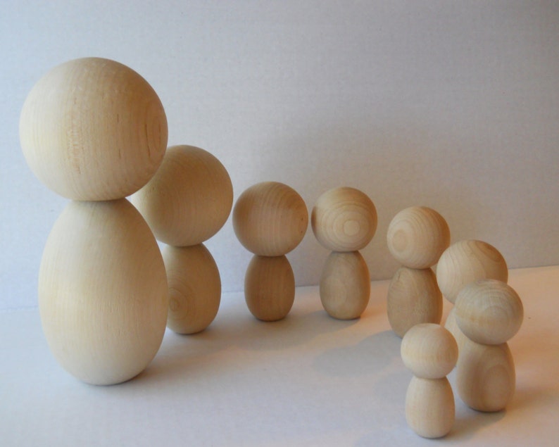 unfinished kokeshi dolls