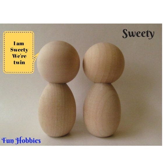 unfinished kokeshi dolls