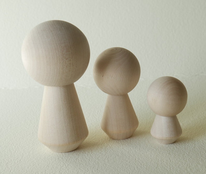unfinished kokeshi dolls