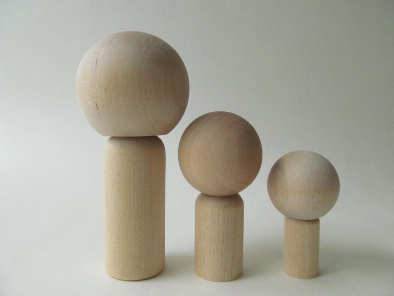 unfinished kokeshi dolls