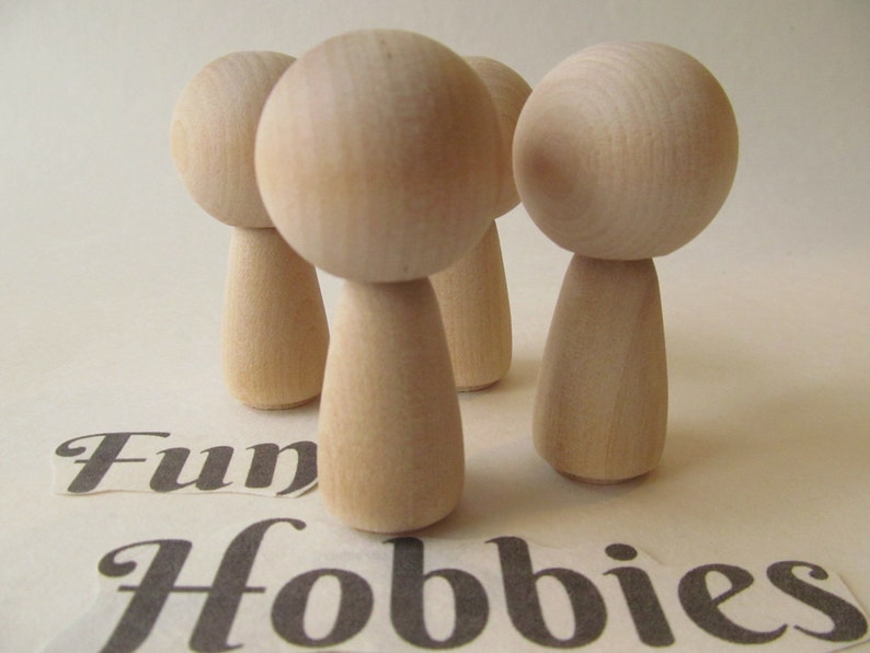 unfinished kokeshi dolls