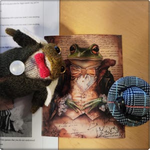 May include: An artistic composition featuring a frog illustration in formal attire, a knitted frog toy with a bow tie, and a small plaid hat. The frog illustration has a bow tie and a vest. The knitted frog toy has a red bow tie.