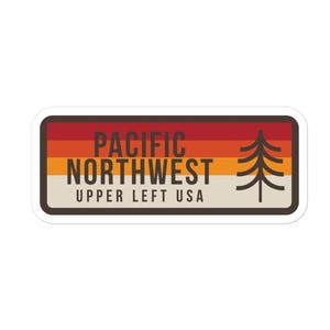 May include: A rectangular sticker featuring a horizontal striped background in shades of red, orange, and cream. The text reads PACIFIC NORTHWEST UPPER LEFT USA in dark brown, accompanied by a stylized dark brown evergreen tree icon on the right.