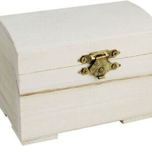 May include: A white wooden chest with a hinged lid and a brass latch. The chest has a slightly rounded top and a rectangular base.
