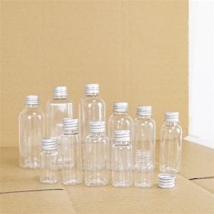 20 piezas Mini Kit de viaje Botellas rellenables de plástico PET Frasco de almacenamiento portátil vacío con tapa de rosca de aluminio A prueba de fugas Saludable