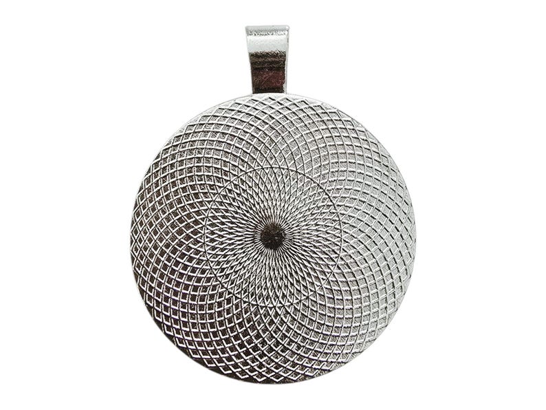 May include: A silver-colored pendant with a round, textured face and a small loop at the top. The face features a spiral pattern of intersecting lines, creating a detailed, geometric design. The pendant is likely for jewelry making or crafting.