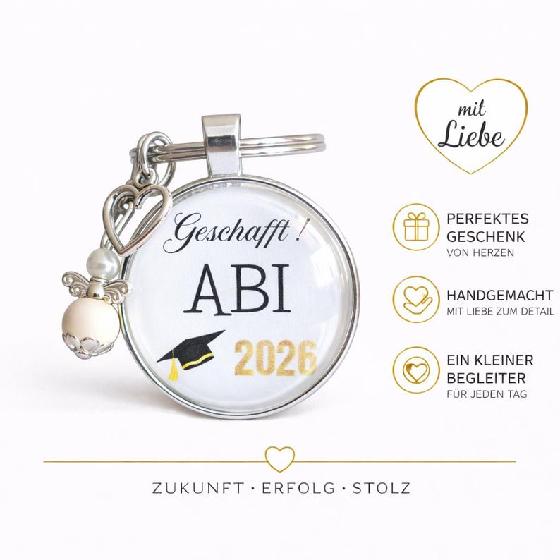 May include: A silver keychain with a round pendant featuring the text "Geschafft! ABI 2026" and a graduation cap graphic. The keychain includes a heart charm and an angel-shaped bead. The image also includes text in German.