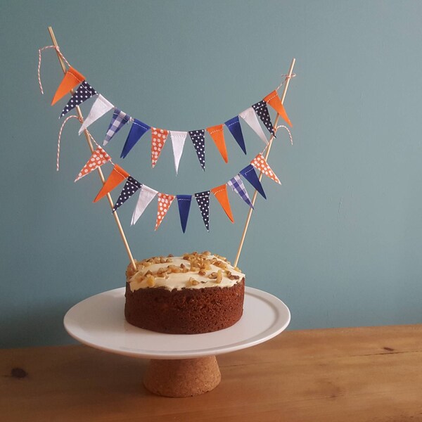 An orange and blue woodland theme fabric cake topper bunting.