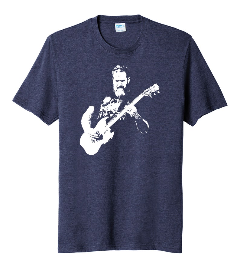 May include: A navy blue t-shirt with a white silhouette of a man playing a guitar.