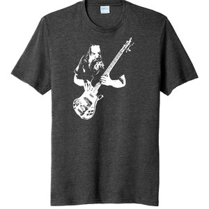 May include: A dark heather grey t-shirt with a white silhouette of a musician playing a bass guitar.