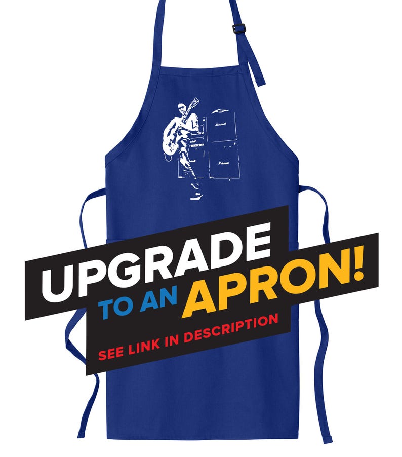 May include: A blue apron with a white graphic of a person playing a guitar in front of an amplifier. The text "Upgrade to an Apron!" is in black, yellow, and red letters.