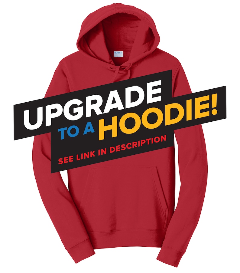 May include: Red hooded sweatshirt with the text "Upgrade to a Hoodie!" in black, blue, and yellow. The text "See link in description" is also included in black.