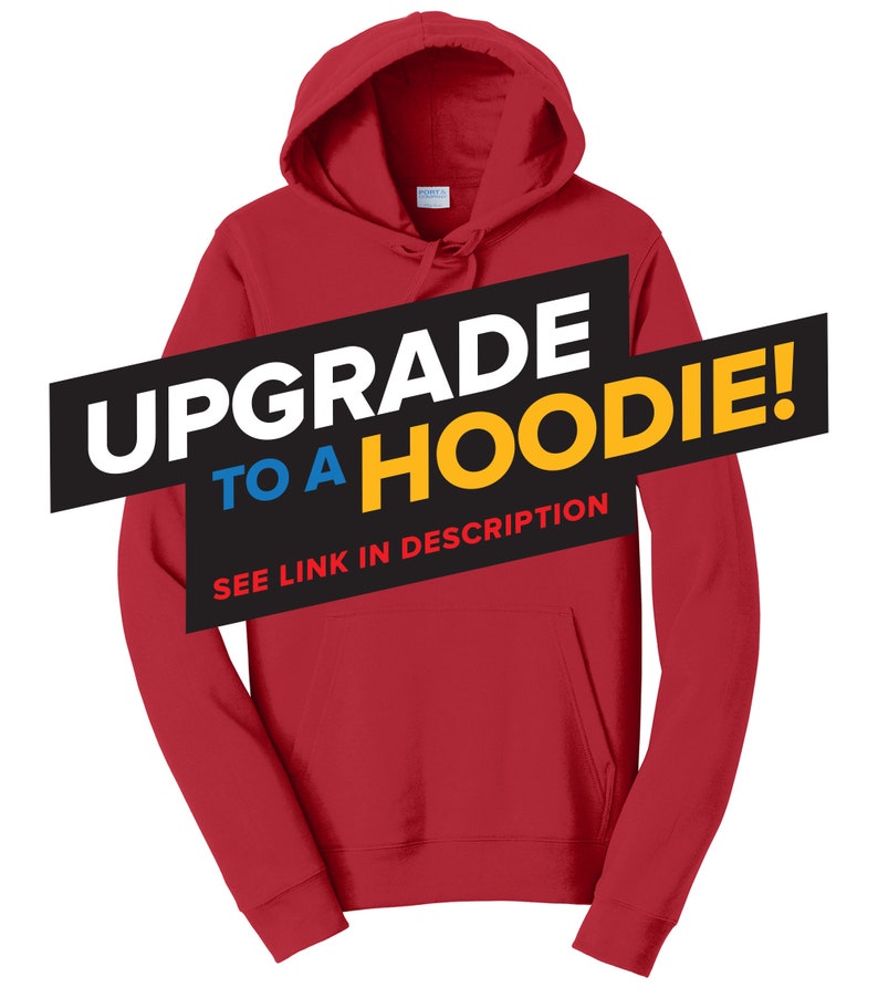 May include: Red hooded sweatshirt with the text "Upgrade to a Hoodie!" in black, blue, and yellow. The text "See link in description" is also included in black.