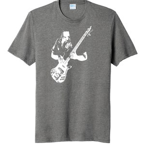 May include: A heather grey t-shirt with a white silhouette of a musician playing a bass guitar.