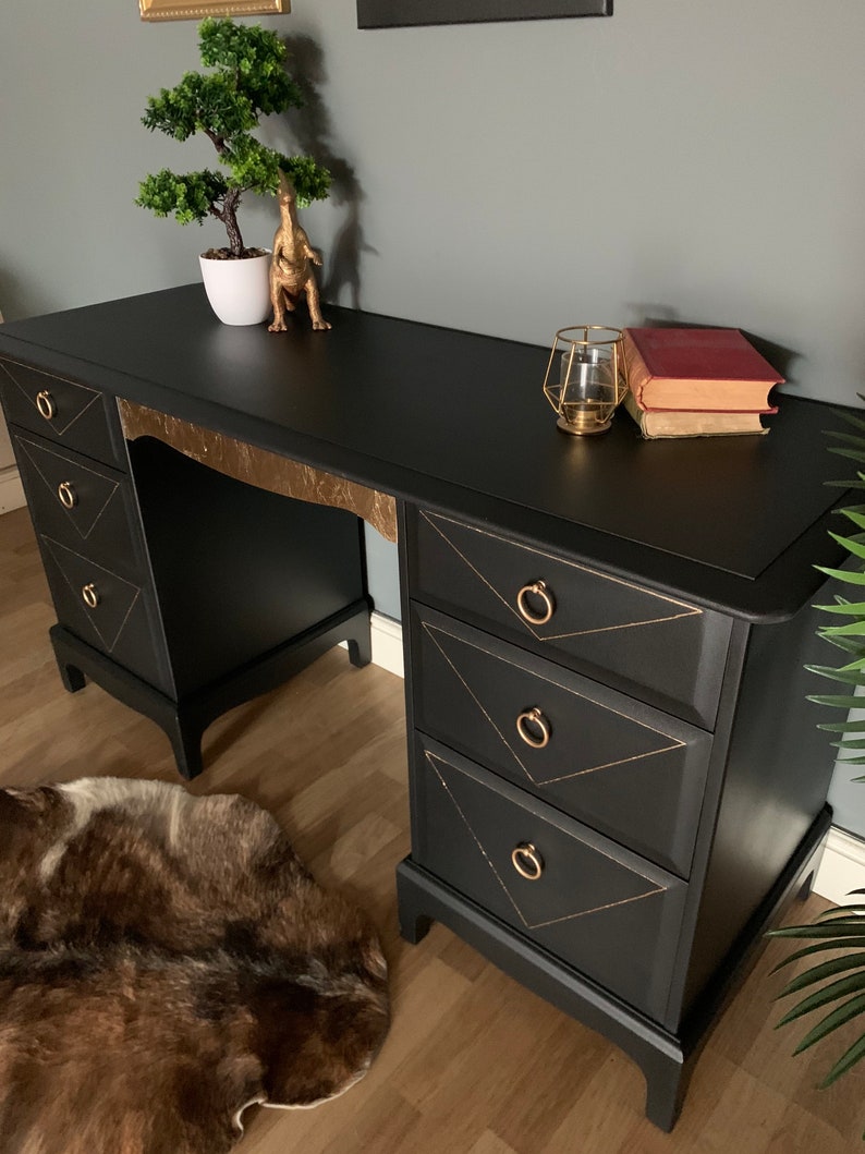 Black stag desk/dressing table with a gold leaf design. Etsy
