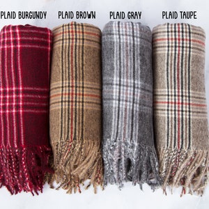 May include: Four plaid scarves in burgundy, brown, gray, and taupe with fringe edges.