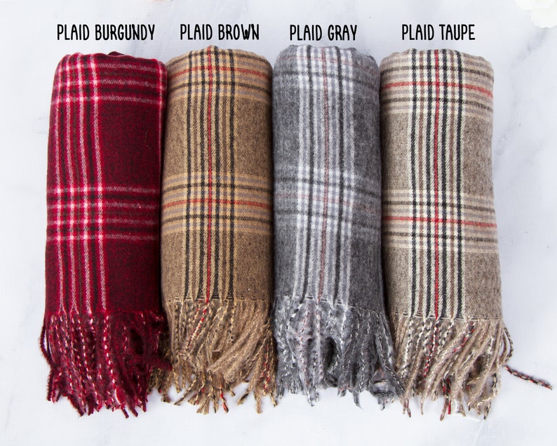 May include: Four plaid scarves in burgundy, brown, gray, and taupe with fringe edges.