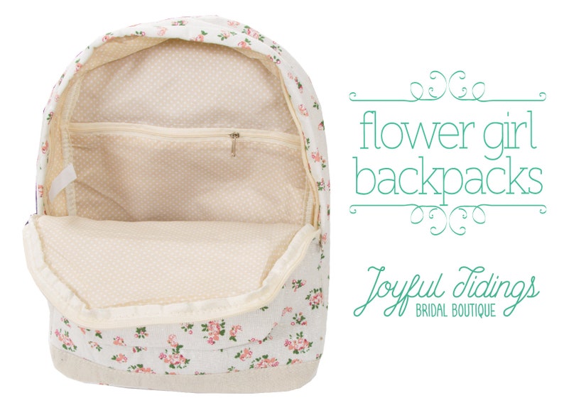 May include: A white canvas backpack with a floral print. The backpack has a zippered pocket on the front and a large main compartment. The backpack is open and the inside is lined with a cream-colored fabric. The text "flower girl backpacks" is written in green on a white background.