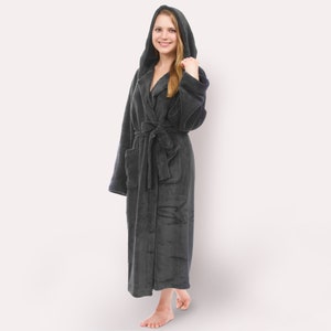 May include: A dark gray hooded robe with a tie belt. The robe is made of a soft, plush material.