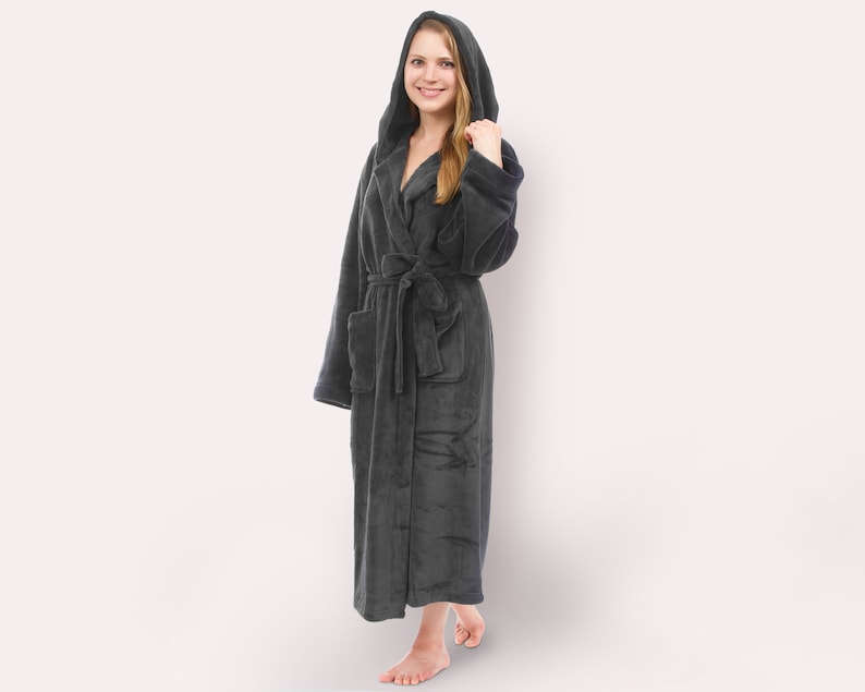 May include: A dark gray hooded robe with a tie belt. The robe is made of a soft, plush material.