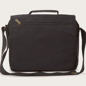 May include: A black canvas messenger bag with a zippered pocket and a top handle. The bag has a long adjustable shoulder strap.