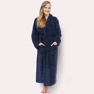 May include: A long, navy blue robe with a hood and pockets. The robe is made of a soft, plush material.