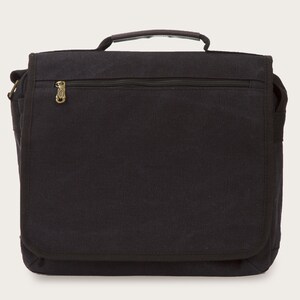 May include: A black canvas messenger bag with a zippered pocket and a gold zipper pull. The bag has a flap closure and a shoulder strap.