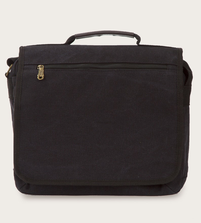 May include: A black canvas messenger bag with a zippered pocket and a gold zipper pull. The bag has a flap closure and a shoulder strap.