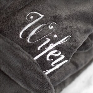 May include: Gray robe with a white embroidered word "wifey" on the front.
